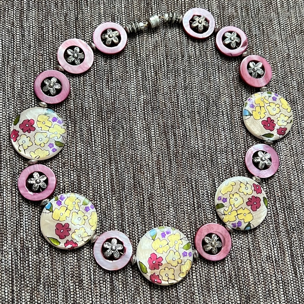 Pretty pink necklace, studded ring, and pastel bracelet